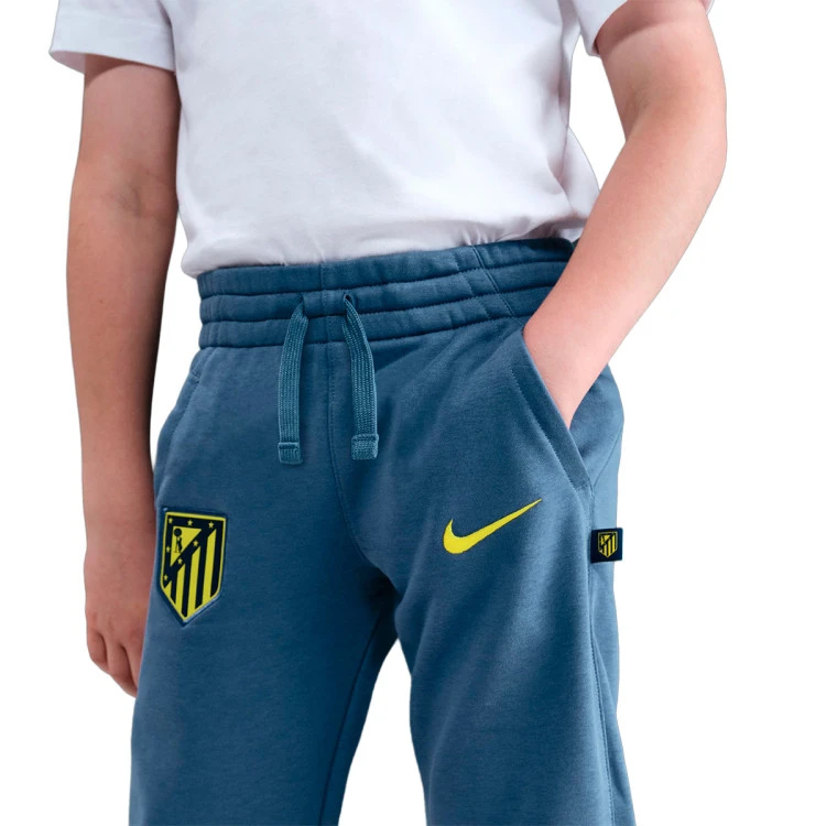 pantalon-largo-nike-atl-madrid-fanswear-2025-2026-nino-diffused-blue-vibrant-yellow-no-sponsor-3