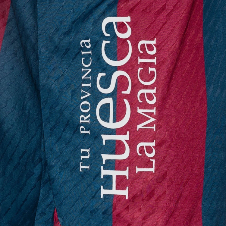 camiseta-soka-sd-huesca-primera-equipacion-nino-2026-2027-sdh-blue-sdh-red-5